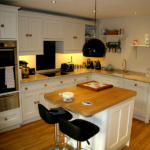 This Charming and Quaint Kitchen is just perfect for the space available. Wooden Handles and island coupled with granite worktops.